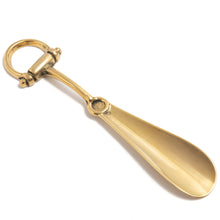 Brass shoehorn with stirrup handle